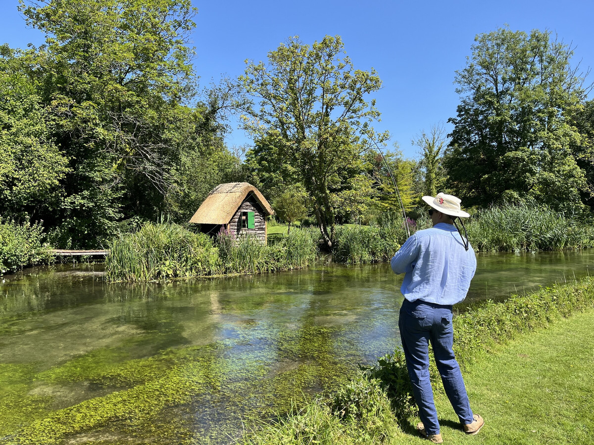 Playing a trout on the River Itchen